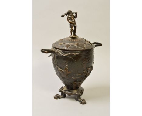 A BRONZE TWIN HANDLED URN AND COVER, of Victorian style, inscribed 'CAIN' to lower body, on three paw feet, height 30cm