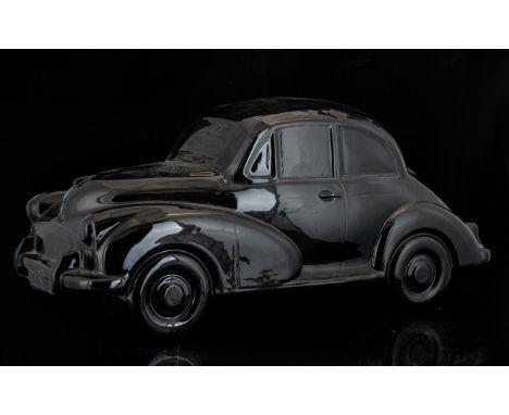 Large Scale Ceramic Model Of Morris Minor Car Black glazed ceramic, 15 inches in length.