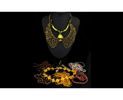 A Collection Of Costume Jewellery Necklaces Nine items in total to include statement seed bead and disc necklace, black ceram