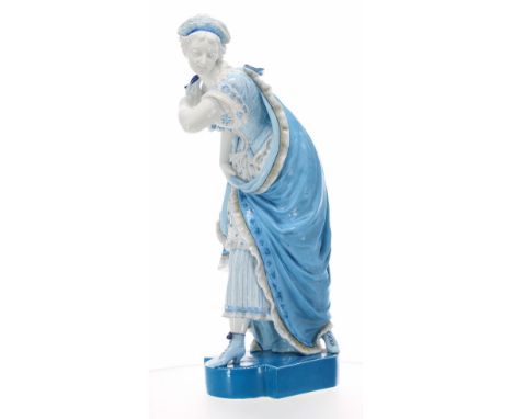 Good large Late 19th century porcelain figure of a dancing lady, in a ball gown holding a mask, pale blue glaze upon a shaped