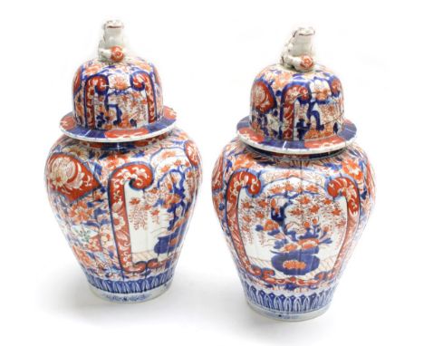 Pair of 19th century Japanese Imari porcelain jars and covers, 15" high (one cover damaged, repair and with losses) (2)