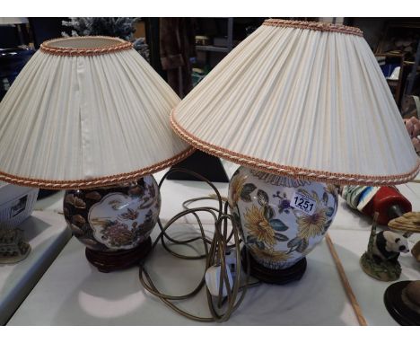 Two Oriental style ceramic lamps with shades. All electrical items in this lot have been PAT tested for safety and have passe