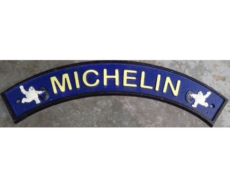 Cast iron curved Michelin sign, W: 30 cm. P&amp;P Group 1 (£14+VAT for the first lot and £1+VAT for subsequent lots) 