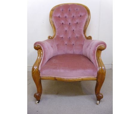 A late Victorian satin walnut, showwood framed spoonback armchair, part button upholstered in braided, dusky pink dralon, the
