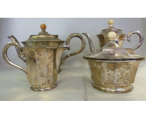 A Czechoslovakian four piece silver coloured metal tea/coffee set of panelled circular form, the teapot having a C-scrolled h