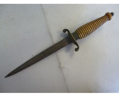 A mid 19thC dagger, having a ribbed horn handle and curved quillions  the blade 8.5''L