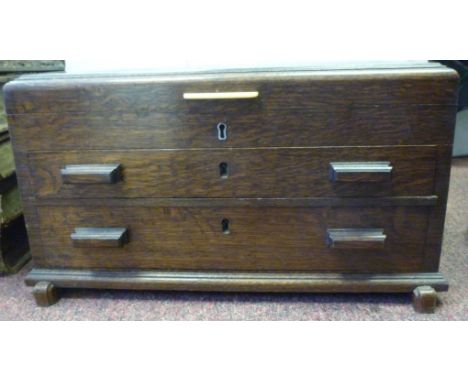 An Art Deco stained oak cased, table-top canteen of Elkington & Co silver plated flatware and cutlery, on ivorine handles com