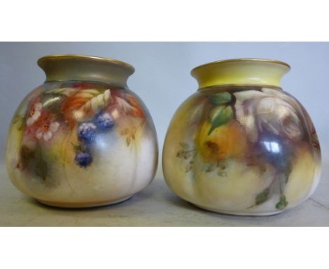 A matched pair of early 20thC Royal Worcester blush ivory glazed china Hadley Ware bag pots, respectively decorated with blac