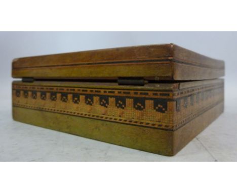 A Tonbridgeware shallow trinket box, having straight sides and a hinged lid, decorated with segmented and other geometric des