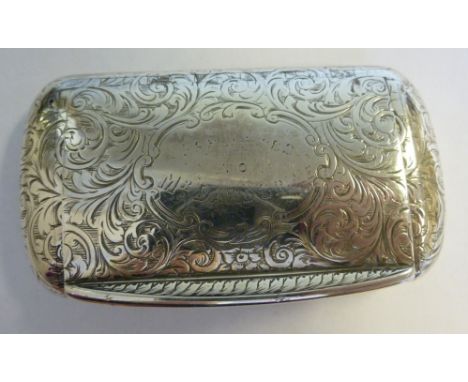 A mid Victorian silver cushion shaped snuff box, a flush fitting, hinged lid, decorated with bright-cut engraved foliate scro