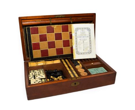 A Victorian Mahogany Cased Games Compendium, of rectangular form, containing two boards with playing surfaces for chess, back