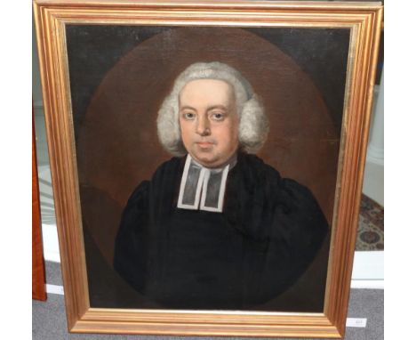 Follower of Sir Joshua Reynolds (1712-1792) Portrait of a clergyman, half length, in a feigned oval Oil on canvas, 74cm by 61