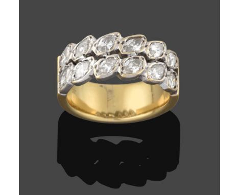 A Diamond Ring, the twelve marquise cut diamonds arranged in two rows in white claw and collet settings, to a yellow plain po