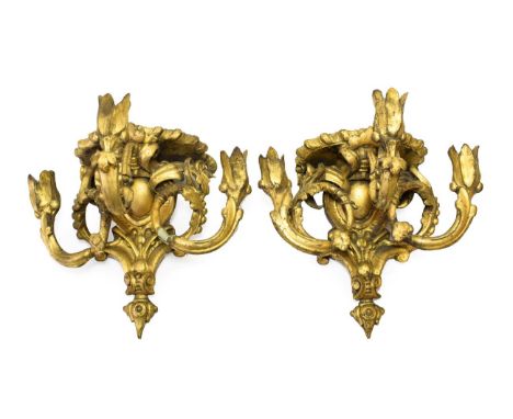 A Pair of Giltwood and Gesso Three-Light Wall Brackets, 19th century, with gadrooned oval plinths over leaf-sheathed scroll b