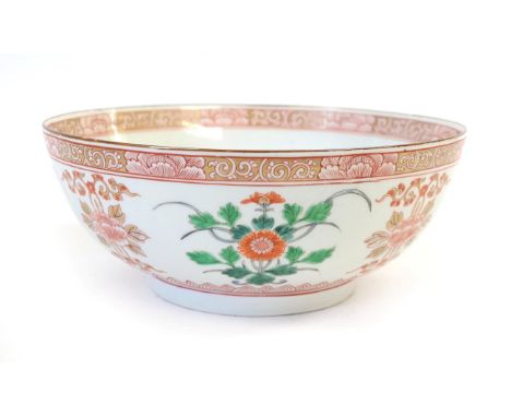 A Chinese Porcelain Punch Bowl, late 19th century, painted in famille vert enamels with stylised foliage within scroll border