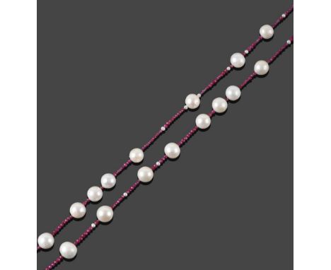 A Ruby and Cultured Pearl Necklace, faceted ruby roundel beads spaced by cultured pearls, length 97.5cm see illustration.  Th