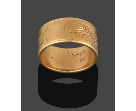 A Canadian Band Ring, the yellow band engraved with an abstract pattern, finger size Q see illustration .  The ring is in goo