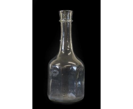A Glass Serving Bottle, circa 1740, the cylindrical neck with trailed string ring over an octagonal section body, 21.5cm high