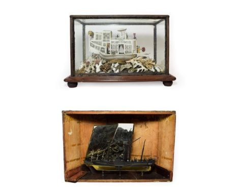 A Cantonese Ivory Model of a Junk, 19th century, with carved and pierced decoration and with crew and passengers, on a mound 