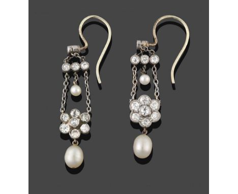 A Pair of Edwardian Diamond and Pearl Drop Earrings, circa 1900, an old cut diamond suspends two chain links to a trio of dia