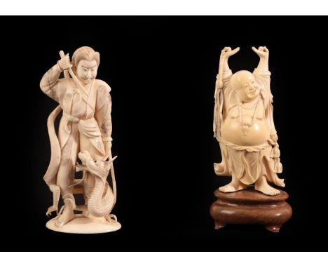 A Japanese Ivory Okimono as a Samurai, Meiji period, standing holding a knife, a dragon at his feet, on an oval base, signed 