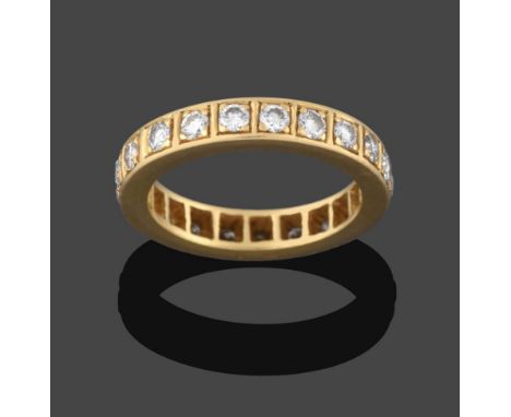 An 18 Carat Gold Diamond Eternity Ring, twenty-one round brilliant cut diamonds in yellow claw and channel settings, total es
