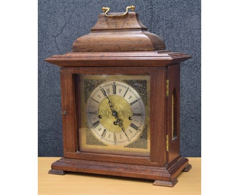 West Germany mahogany cased bracket clock, the 7.5" brass dial with silvered chapter ring and Roman numerals, the back plate 