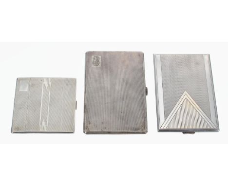 Three silver cigarette cases with engine turned decoration, by Cohen &amp; Charles 5" x 3.25", John Henry Wynn 6.25" x 3.25",