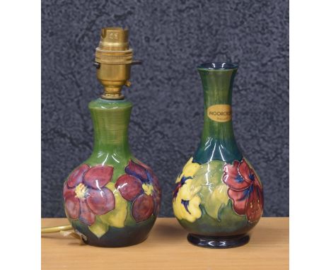 Moorcroft Pottery 'Clematis' small table lamp, 7.5" high including fitting; together with a Moorcroft Pottery 'Hibiscus' bott