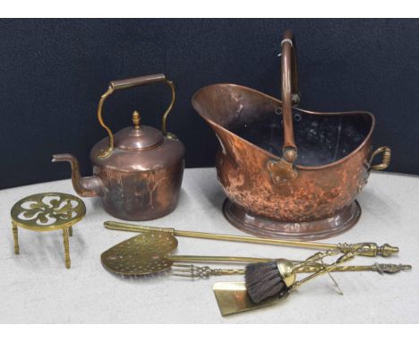 Collection of Victorian fireside tools including copper coal helmet, copper kettle, brass trivet, fork, poker etc 