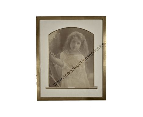 Julia Margaret Cameron (1815-1879),  untitled, small girl in white smock dress, looking left, with hands raised to right, ink