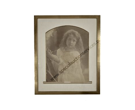 Julia Margaret Cameron (1815-1879),  untitled, small girl in white smock dress, looking left, with hands raised to right, ink