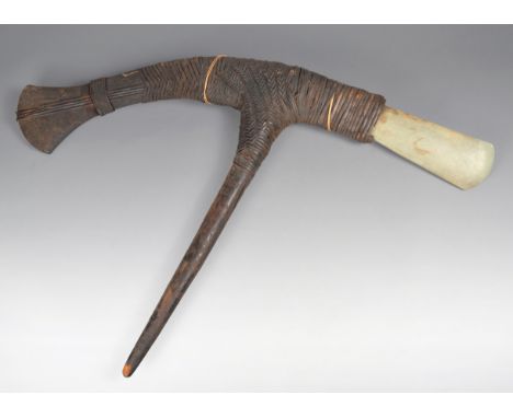 A Papua New Guinea axe Melanesia with a greenstone blade and with woven fibre bindings, 85cm long. (2) Provenance The Bob Wis