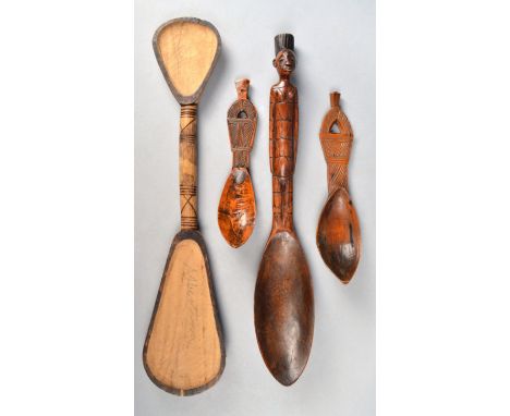 A Mangbetu spoon Democratic Republic of Congo with a figural handle, 40cm long, a Zulu double ended spoon, inscribed Albertin
