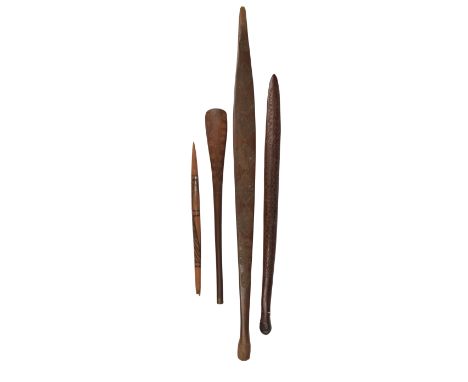 An Aboriginal club Australia with three carved zig-zags and a resin end, 65cm long, an Aboriginal spear thrower with carved l