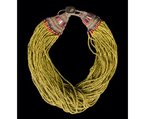 A Naga bead necklace Northern India coloured glass beads, fibre and a square coin button dated 1965.