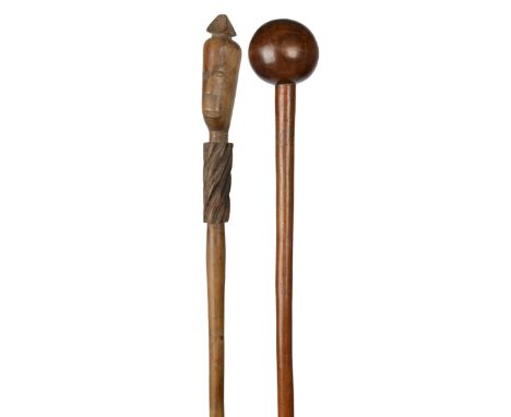 A Zulu staff South Africa with a carved head with a pyramidal headdress and a necklace and a spiral ribbed collar, the shaft 