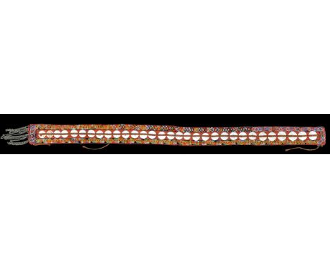A Taiwan ceremonial sash with thirty-one shell discs on a red cloth and bordered with geometric coloured glass beads, one end