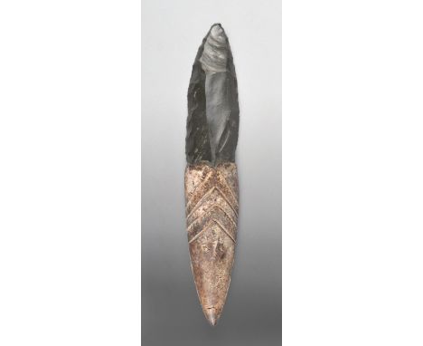An Admiralty Islands dagger Papua New Guinea, Melanesia obsidian, fibre, nut paste and pigment, with incised chevron decorati
