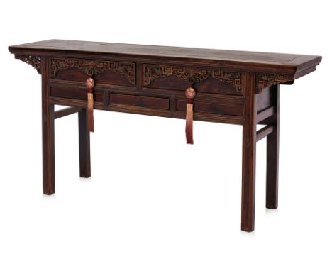 A CHINESE ELM CONSOLE TABLE
Chaozhou, a rectangular Chinese elm table, two drawers with carved peony, birds and bats within k