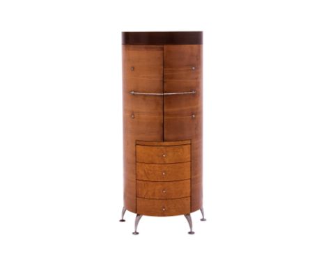 A TALL WOOD COCKTAIL CABINET
Circa late 20th century, produced by MOBI, features a dual cabinet door configuration, granting 