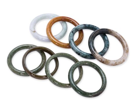 A GROUP OF EIGHT JADE BANGLES
Various tones of jade
55mm to 65mm inner diameter
Condition: For a condition report or further 