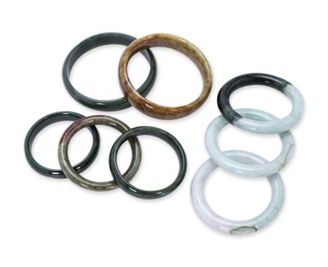 A GROUP OF EIGHT JADE BANGLES
Various tones of jade
50mm to 64mm inner diameter
Condition: For a condition report or further 