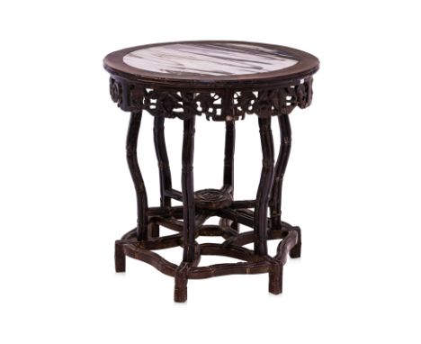 A MARBLE INSET AND BAMBOO CARVED BLACKWOOD TABLE
Circular, with white and grey veined marble top, above a carved and pierced 