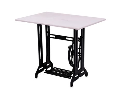A CAST-IRON SEWING TABLE  BASE WITH MARBLE TOP
A converted Raleigh sewing table with cast iron treadle base and rectangular p