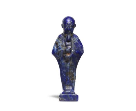  An Egyptian lapis lazuli amulet of Ptah New Kingdom - Late Period, circa 1550-332 B.C.The mummiform deity wearing a close-fi