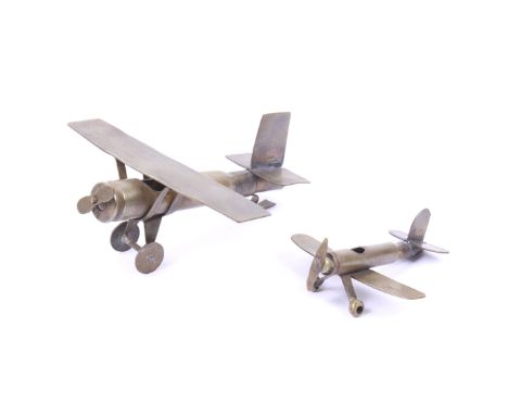 Two WWI Trench Art aeroplanes. Made of brass from bullet shell cases. Length 13cm largest plane, the smaller is 9cm.