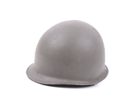 A USA army 'Lone Star' helmet. With Firestone liner and leather chin strap, marked 'Don Williams No.25925605'
