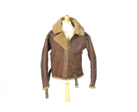 A WWII Royal Air Force flying jacket and related documents belonging to Group Captain E.R. Openshaw.The Irvin pattern brown l