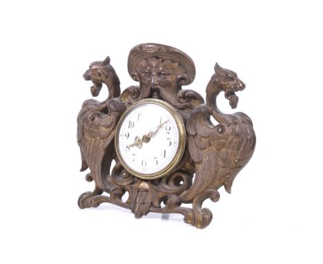 A 20th century mantel clock. The white enamel dial having Arabic numerals and hands with pierced details, the cast metal case